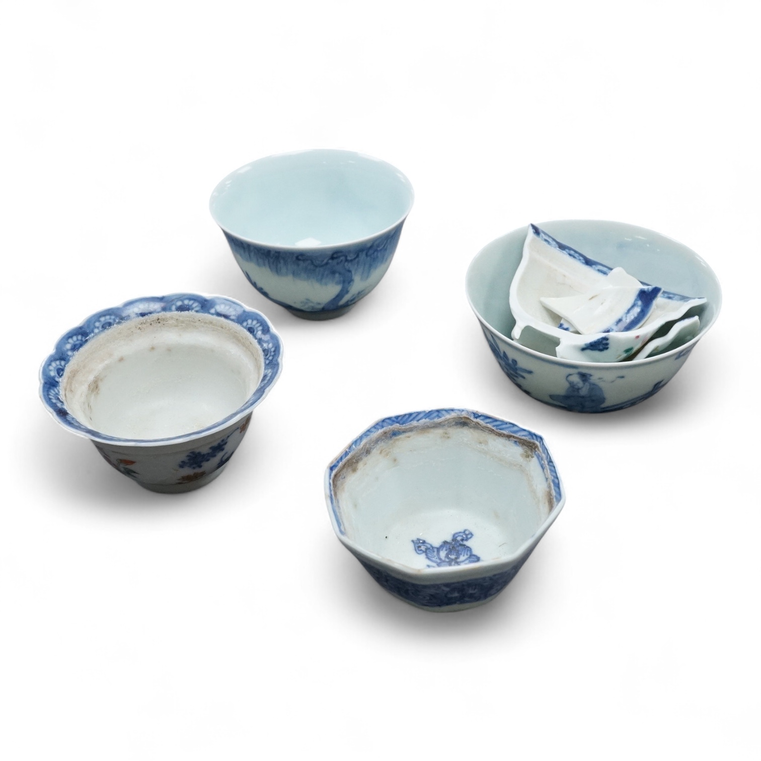 Four Chinese blue and white tea bowls and another (a.f.)